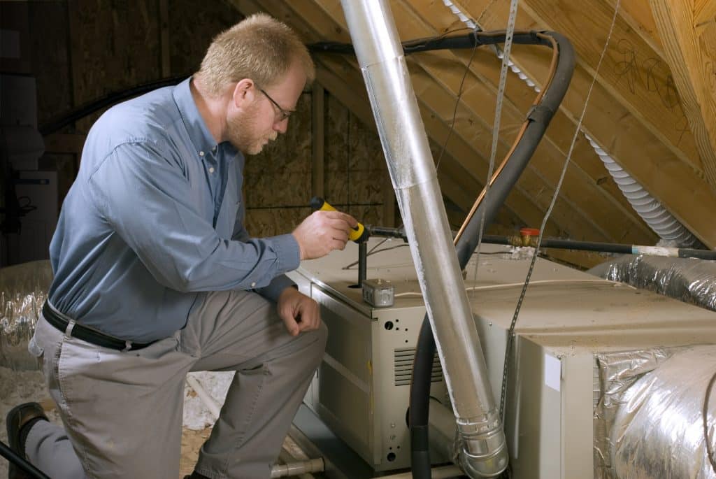 Man inspecting furnace